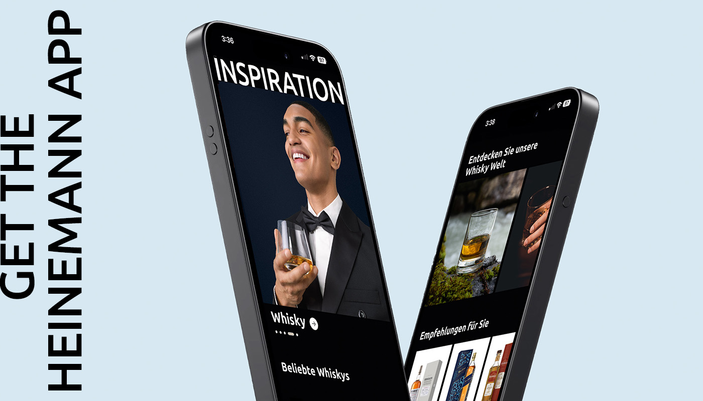 Zwei Smartphones zeigen die Heinemann App mit Whisky-Empfehlungen und dem Text 'INSPIRATION' und 'Entdecken Sie unsere Whisky Welt'